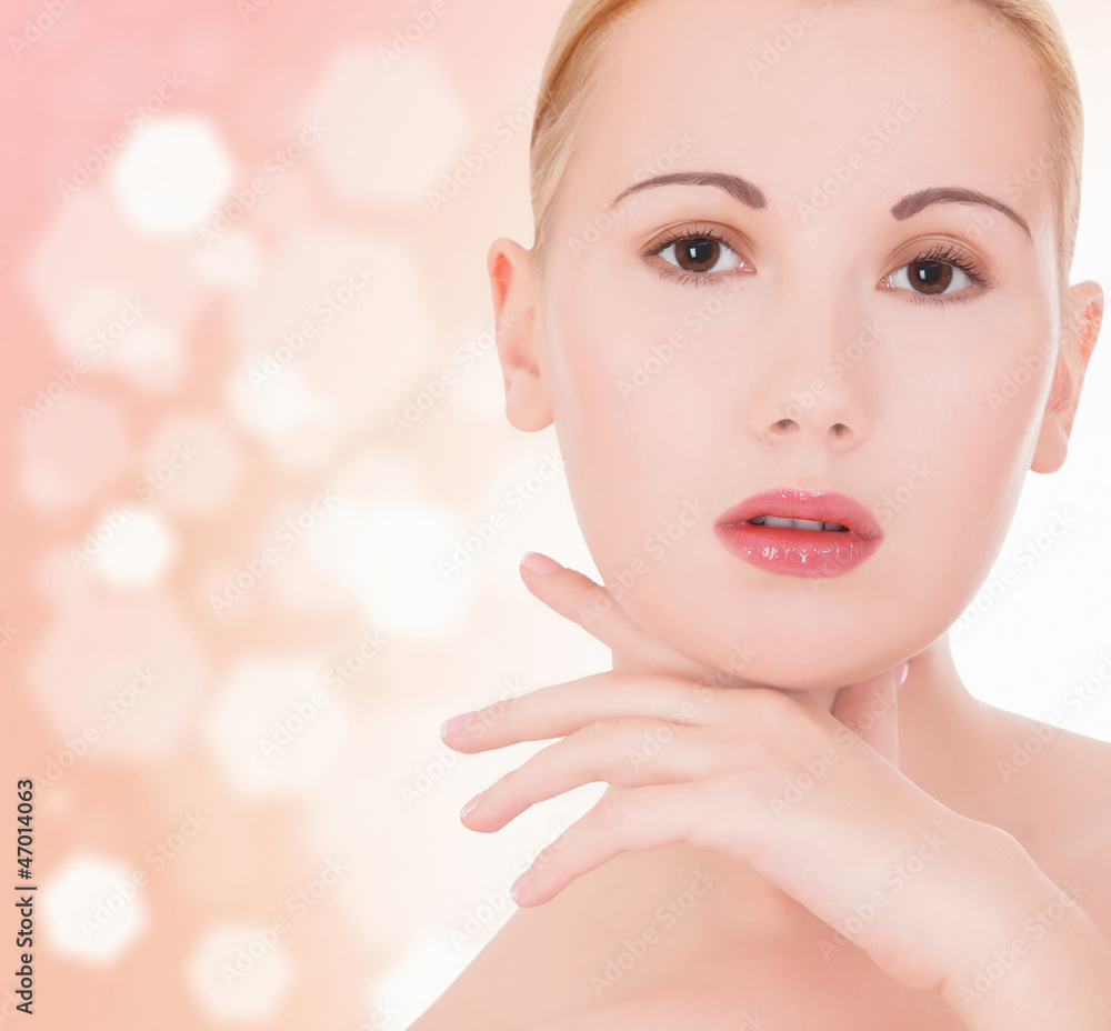 Beautiful healthy woman touching her skin