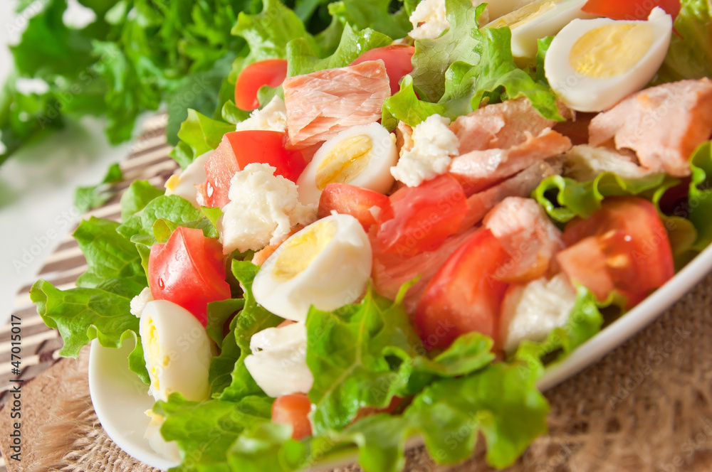 fresh salmon salad, lettuce and quail eggs fresh salmon salad, lettuce and quail eggs