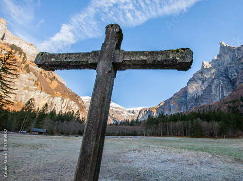 Stone cross and Mountain photo