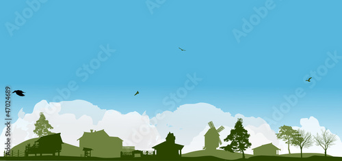 country green landscape under white clouds
