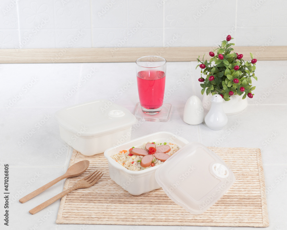 Fried rice with sausages in plastic box for picnic or lunch Fried rice with sausages in plastic box for picnic or lunch