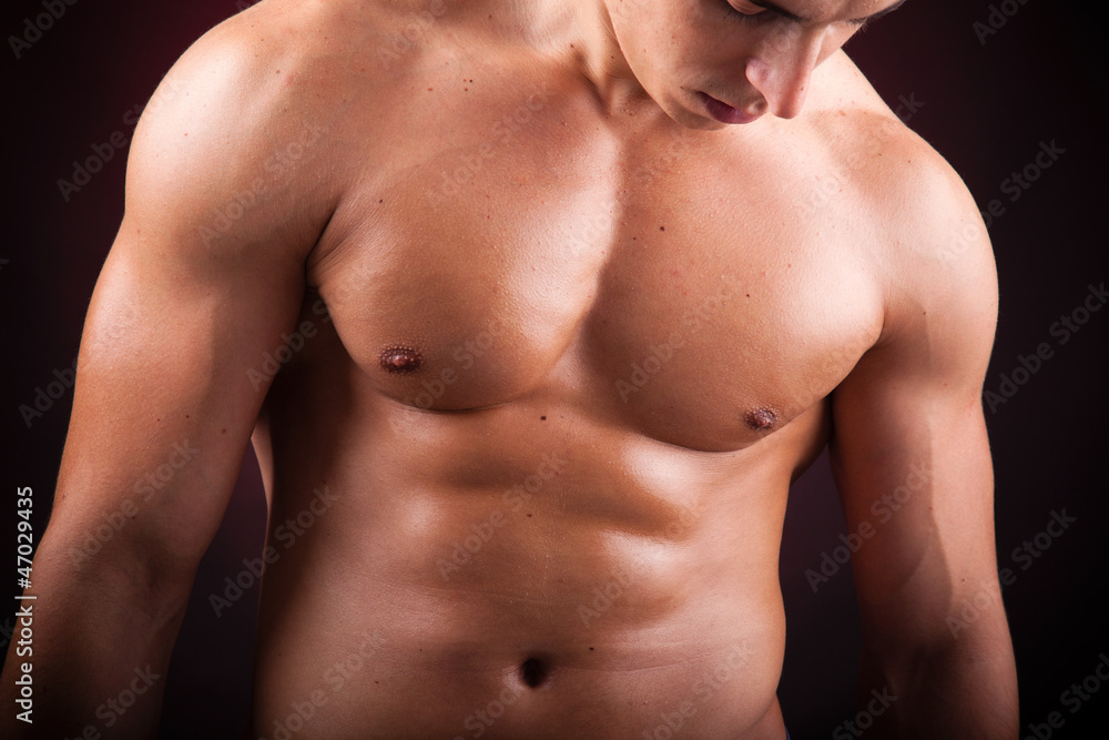 Image of a handsome athletic man on black background