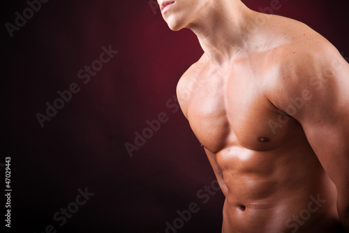 Image of a handsome athletic man on black background