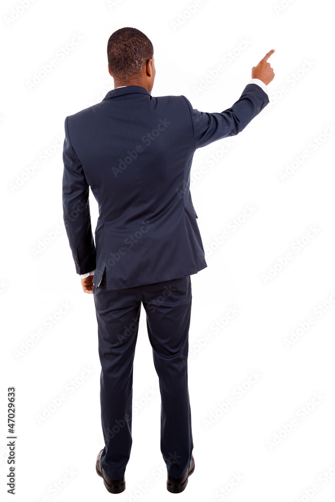 Full length of a African American business man pointing at somet Full length of a African American business man pointing at somet
