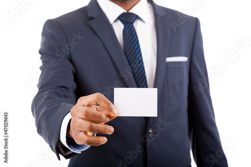 Business man in suit showing his business card