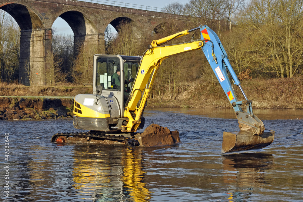 Tracked Digger Dredging River