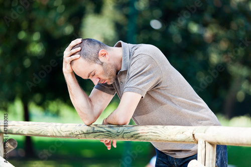 Pensive Adult Man at Park