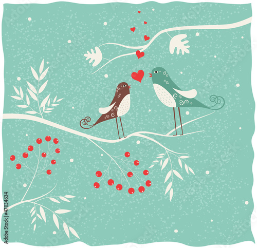 Two birds in love at winter time.