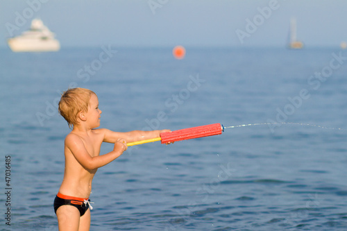 A little boy shooting a jet