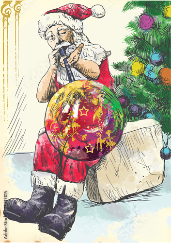 Santa Claus as a glassmaker blows Christmas ornaments