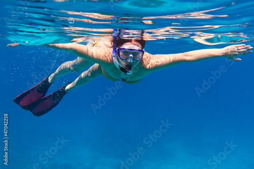 Young women at snorkeling in the sea