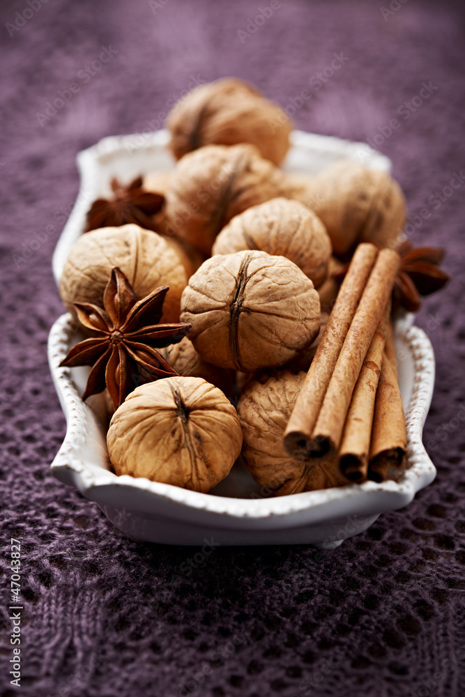 Christmas spices and walnuts in a small dish Christmas spices and walnuts in a small dish