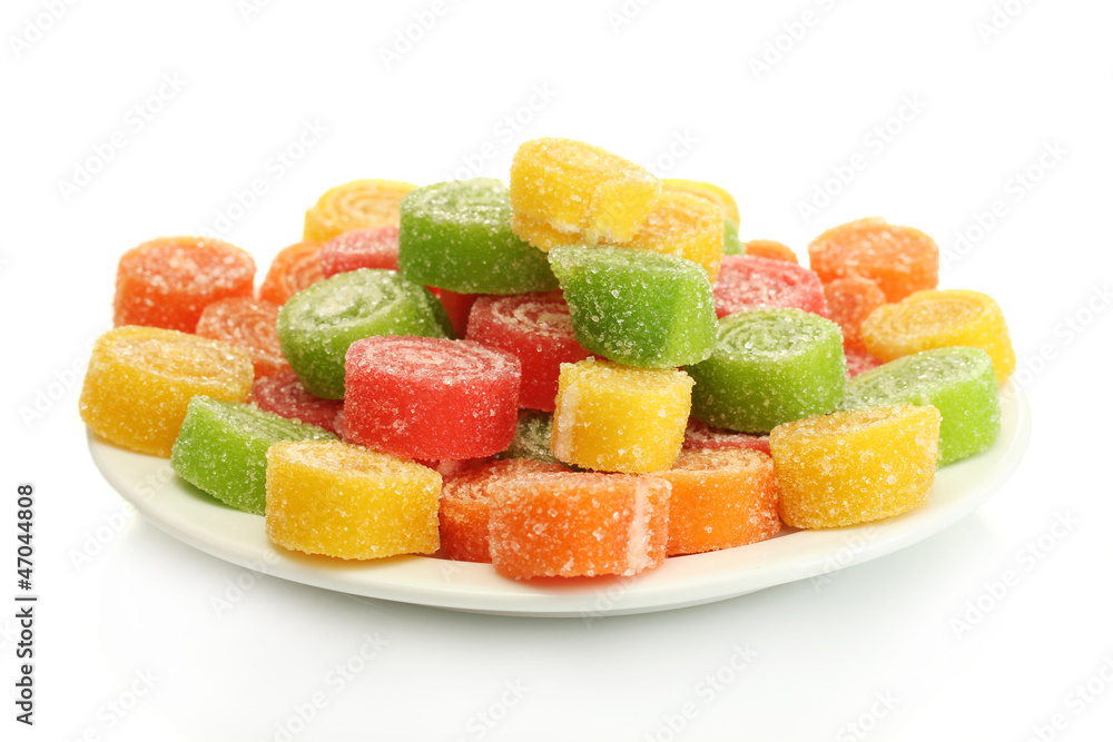 colorful jelly candies on plate isolated on white. colorful jelly candies on plate isolated on white.
