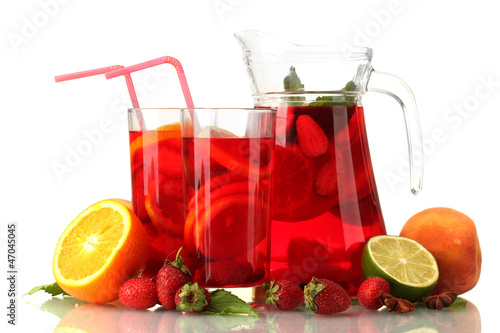 sangria in jar and glasses with fruits, isolated on white