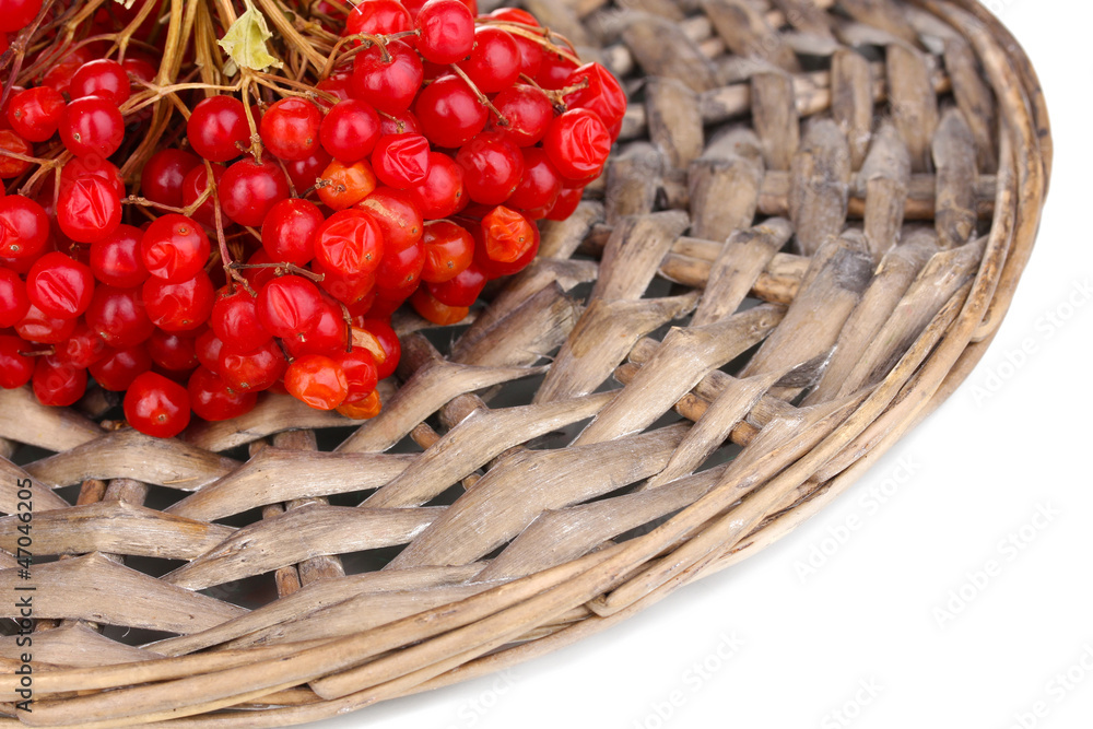 red berries of viburnum on wicker mat close-up red berries of viburnum on wicker mat close-up