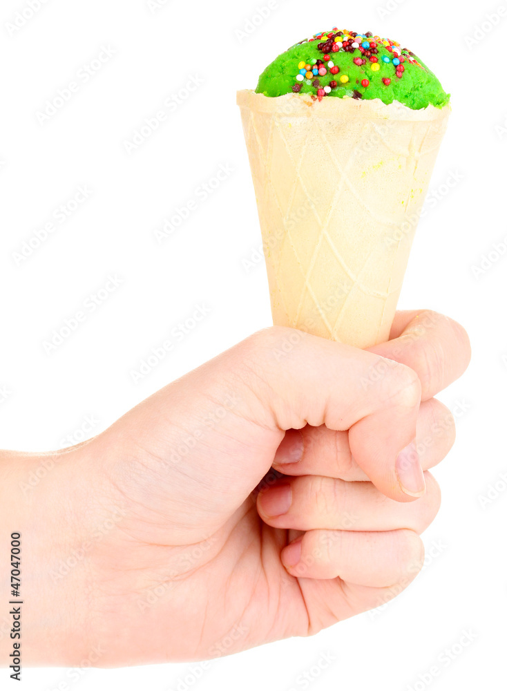 Scoop of kiwi ice cream in the waffle cone decorated with Scoop of kiwi ice cream in the waffle cone decorated with