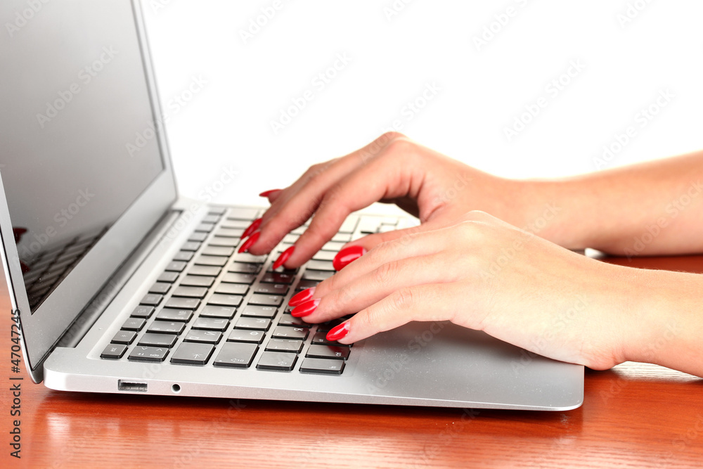 Detail of female hands using computer isolated on white Detail of female hands using computer isolated on white