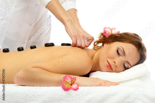 beautiful young woman in spa salon getting massage with spa