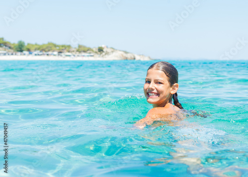 Wallpaper Mural Young girl playing in the sea Torontodigital.ca