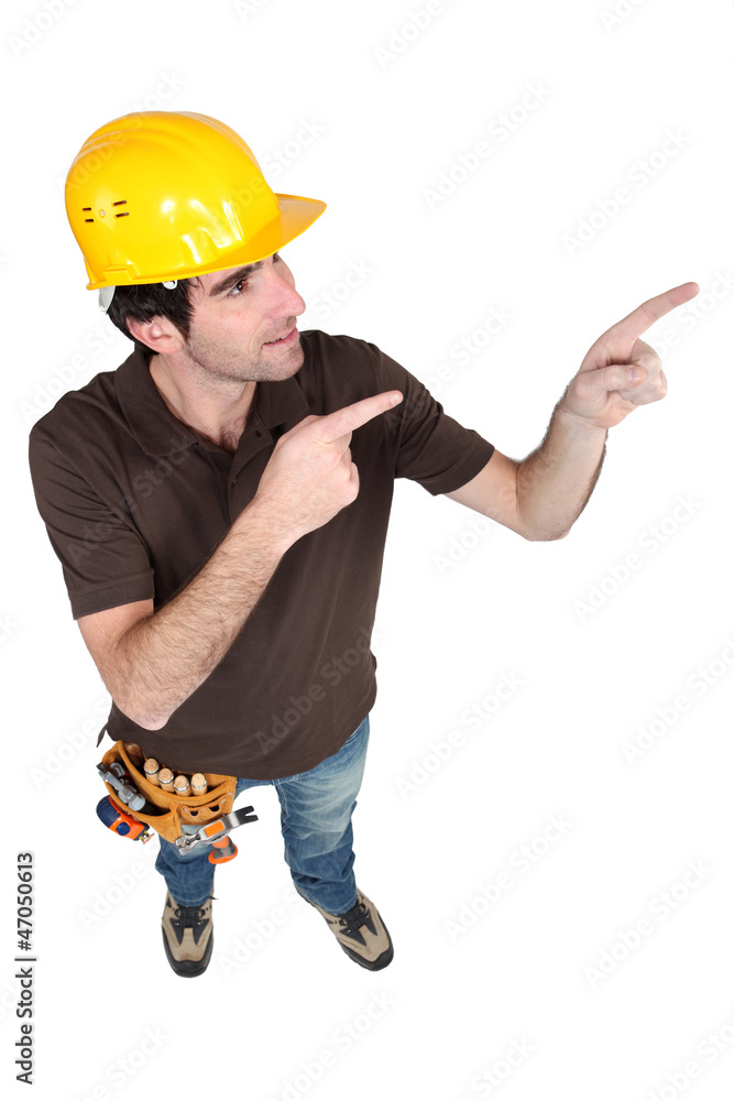 Builder pointing with both hands Builder pointing with both hands