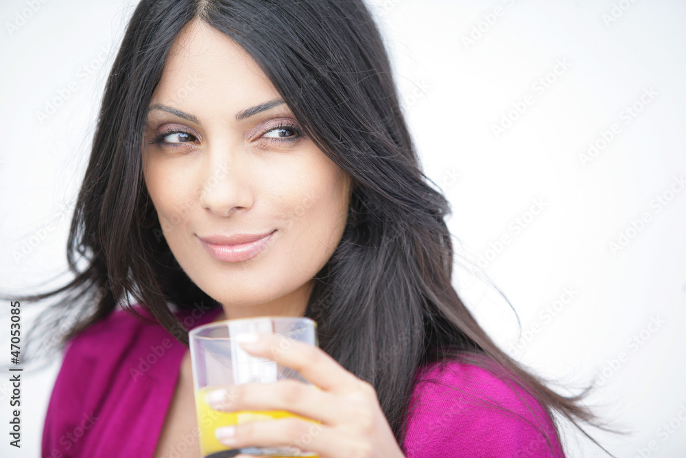 Attractive woman with a glass of orange juice Attractive woman with a glass of orange juice