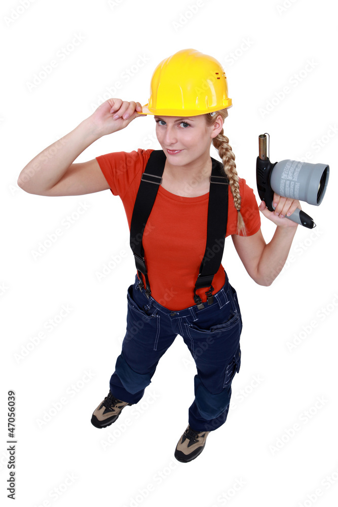 craftswoman holding a welding torch craftswoman holding a welding torch