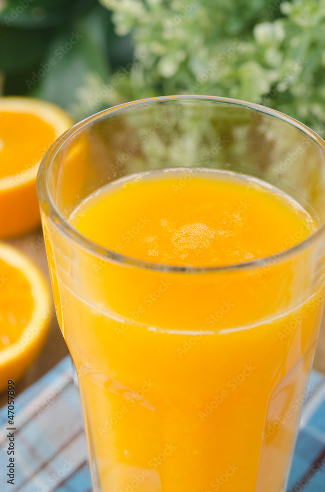 Glass of orange juice close up