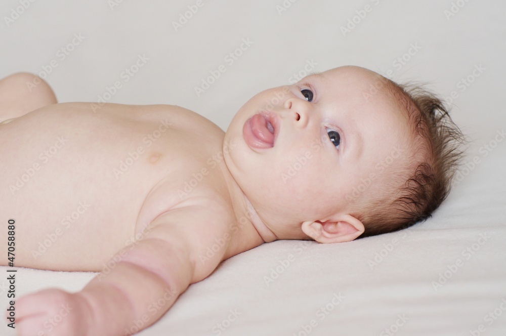 Naked baby who is putting out the tongue (2 months) Naked baby who is putting out the tongue (2 months)