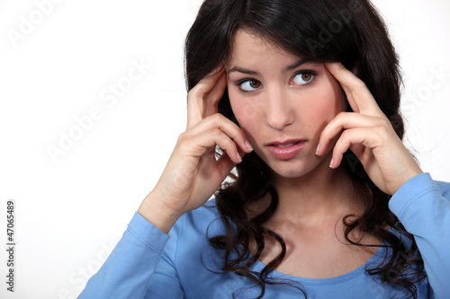 Slika na platnu Woman suffering from a throbbing headache