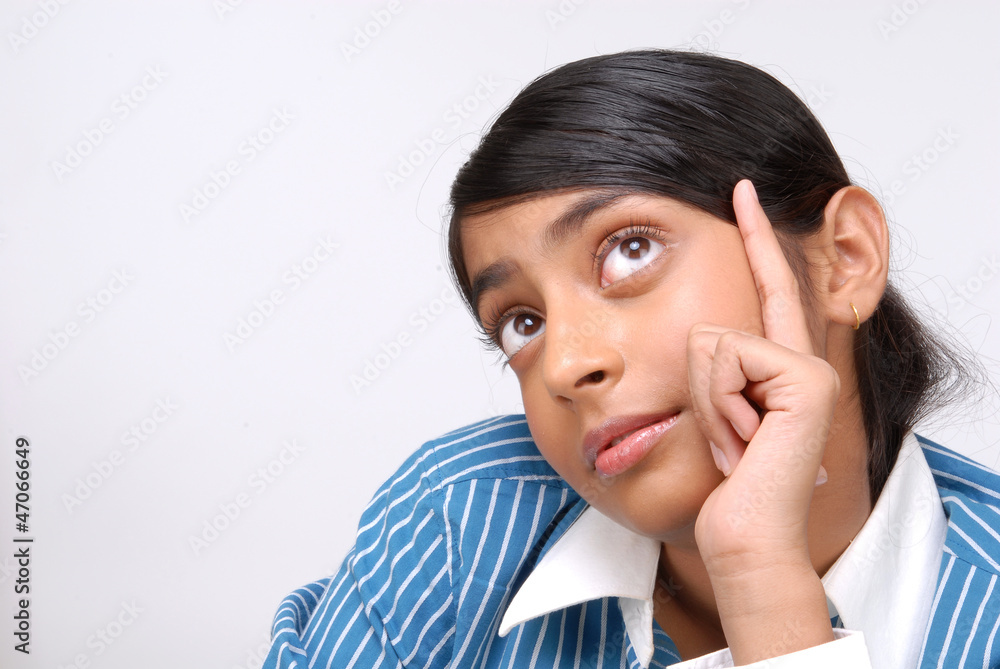 Portrait of happy young Indian girl thinking Portrait of happy young Indian girl thinking