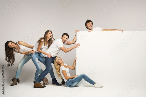 Business people pulling an empty board photo