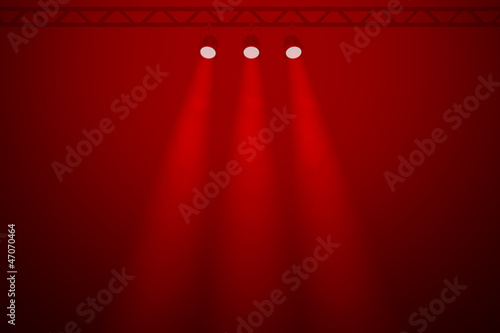 Three spotlights on a red background