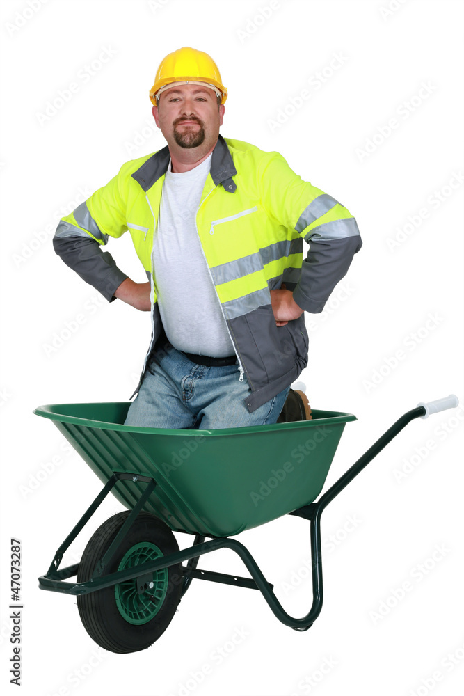 Mason kneeling in wheelbarrow Mason kneeling in wheelbarrow