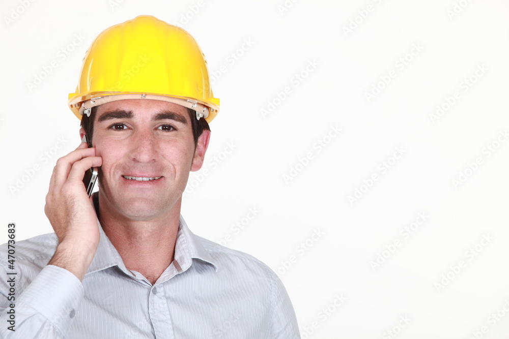 Architect stood making a call Architect stood making a call