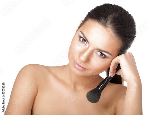 Portrait of attractive young adult woman applying