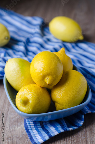 Lemons in the bowl on the table