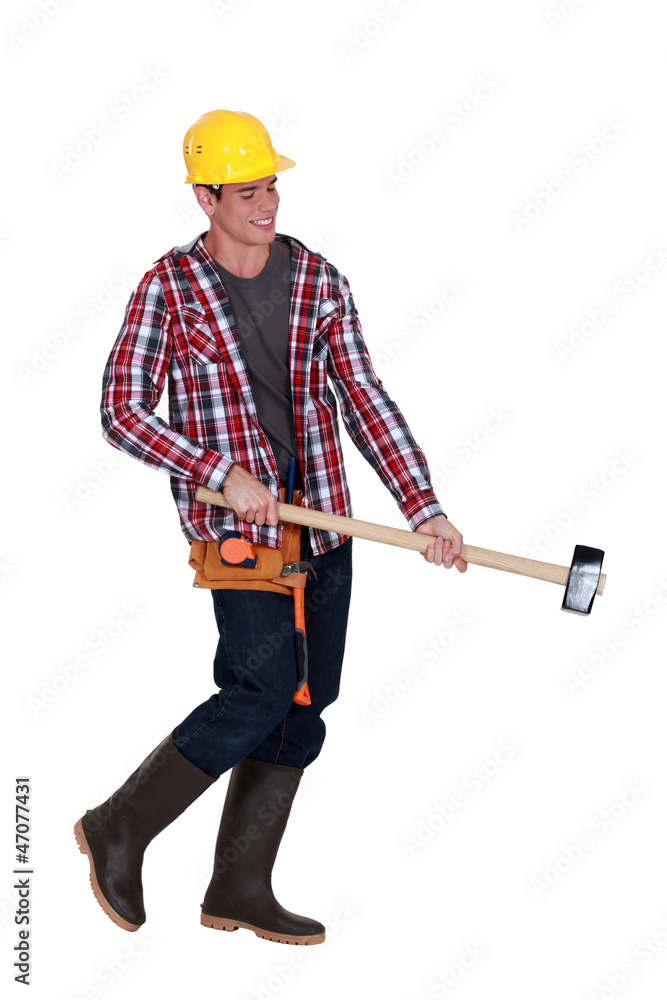 Man wielding sledge-hammer Man wielding sledge-hammer