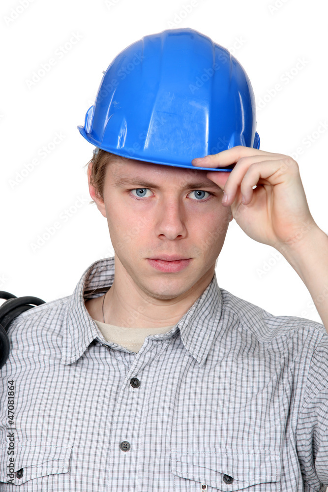 Electrician stood with coil over shoulder Electrician stood with coil over shoulder