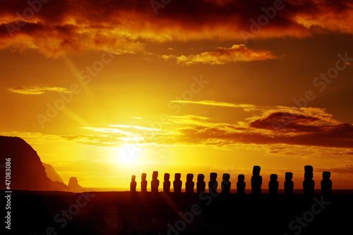 Mysterious stone statues at sunrise in Easter Island