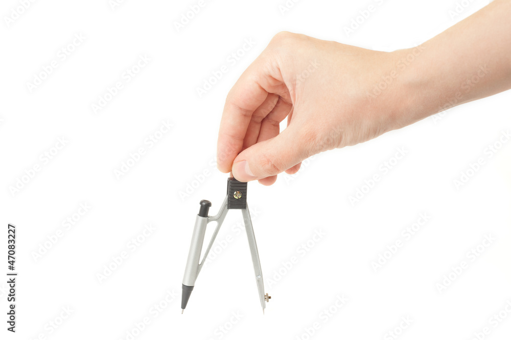 Hand with compass on a white background Hand with compass on a white background