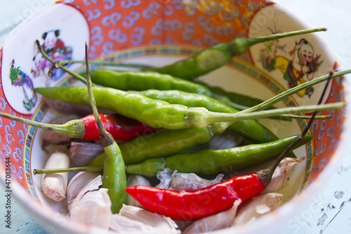 chillies and garlic on a little bowl