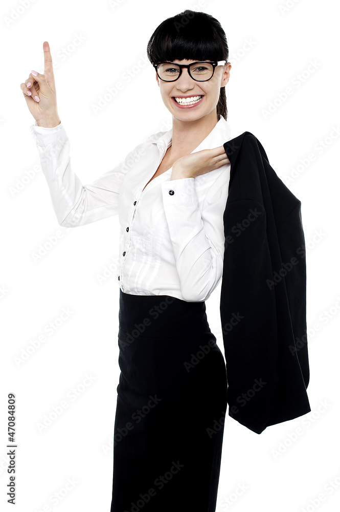 Lively female entrepreneur pointing upwards Lively female entrepreneur pointing upwards