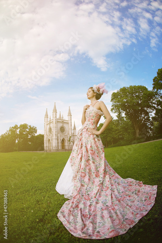 Princess in an vintage dress before the magic castle © Miramiska