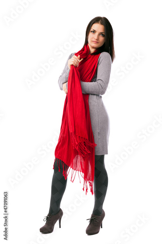 Young woman posing with red scarf