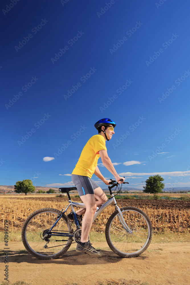Biker in yellow shirt riding a bike, Macedonia Biker in yellow shirt riding a bike, Macedonia