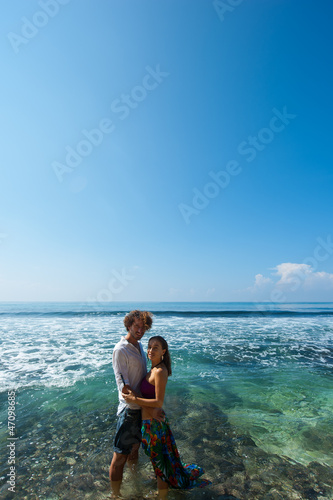 loving couple resting on the beach in the sand on the island of Bali.