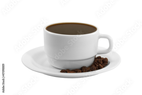 A cup of coffee with beans on a saucer