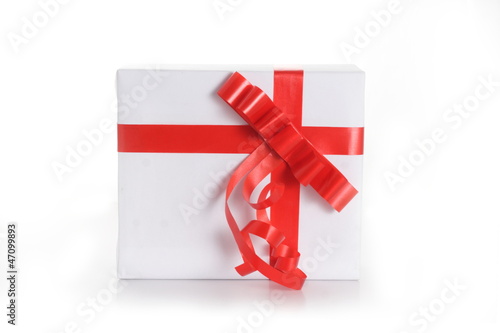 Gift box with red tape on white background