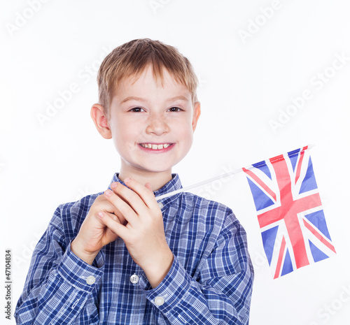 A little boy with english flag on the white background photo