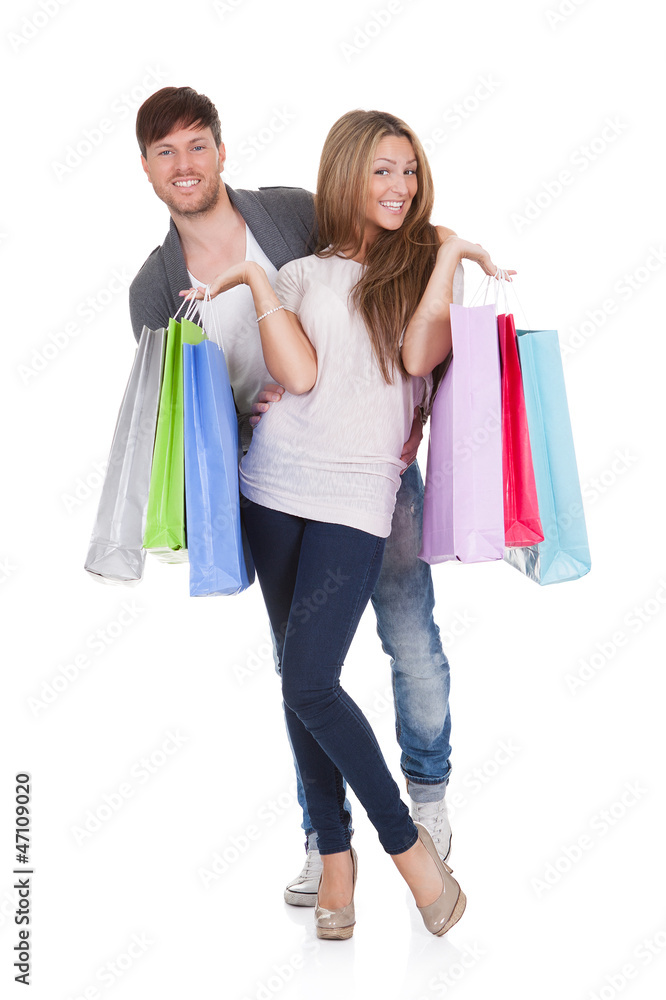 Guy and gal brings shopping bags
